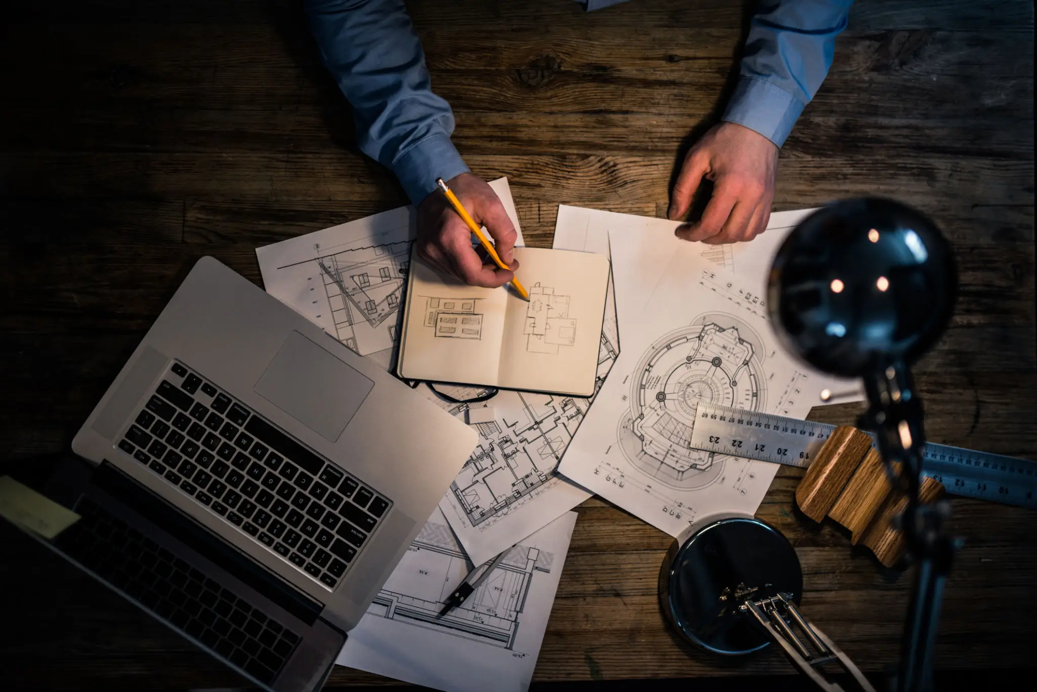Designer working on architectural blueprints